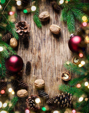 Christmas holiday background with fir branches, pine cones and nuts.  Winter holiday concept composition, copy spaceの写真素材