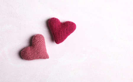Crochet hearts on pink background. Valentine's Day conceptの写真素材