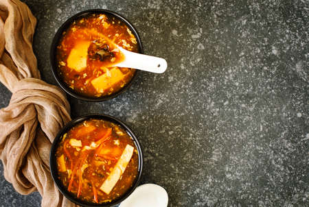 Hot and Sour Soup in bowl, top view, copy spaceの写真素材
