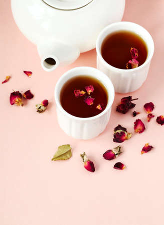 Herbal tea with roses on pink background, copy spaceの写真素材
