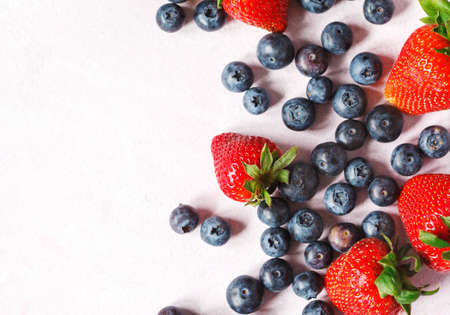 Strawberries and blueberries, copy space, top viewの写真素材