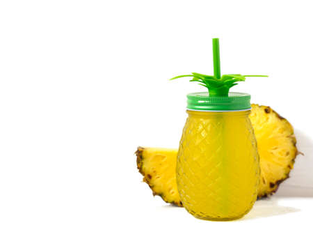 Pineapple juice in bottle isolated on white backgroundの写真素材