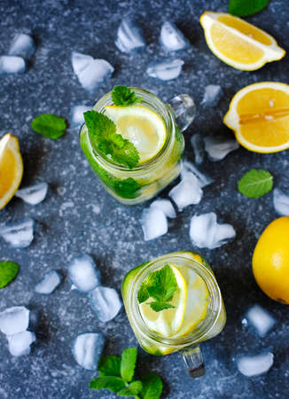 Mason jar glass of lemonade with mint, top viewの写真素材