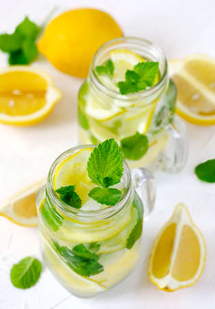 Mason jar glass of lemonade with mint on white backgroundの写真素材
