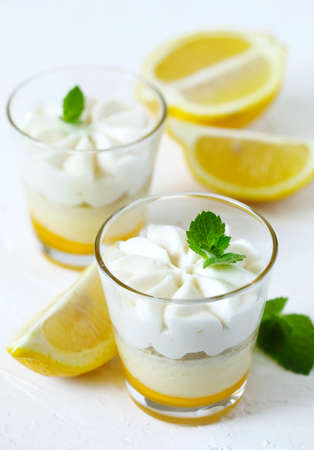 Limoncello - italian Dessert.  Lemon Cheesecake Mousse with Whipped Cream in cups. Summer dessert.の写真素材