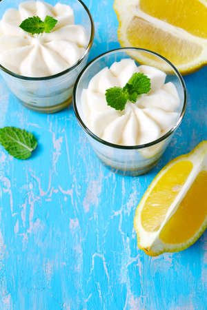 Limoncello - italian Dessert.  Lemon Cheesecake Mousse with Whipped Cream in cups. Summer dessert.の写真素材