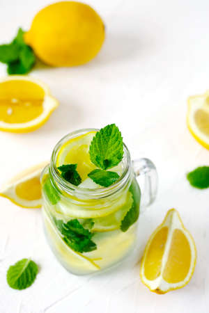 Mason jar glass of lemonade with mint on white backgroundの写真素材