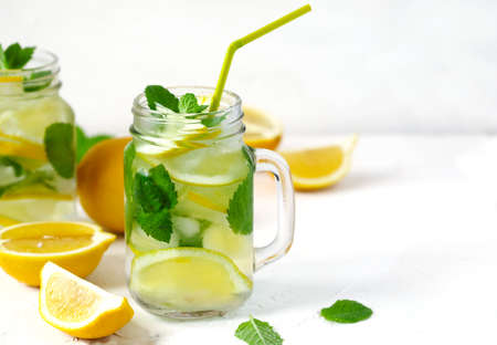 Mason jar glass of lemonade with mint on white background, copy spaceの写真素材
