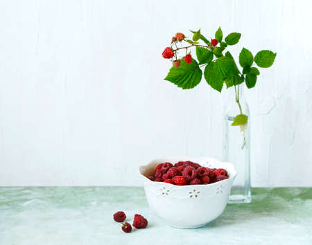 Fresh raspberries in white bowlの写真素材