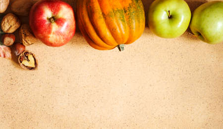 Autumn background with pumpkin, corn and apples, copy spaceの写真素材