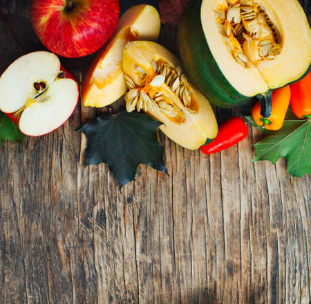 Autumn vegetables and fruits on wooden background. Autumn harvestの写真素材