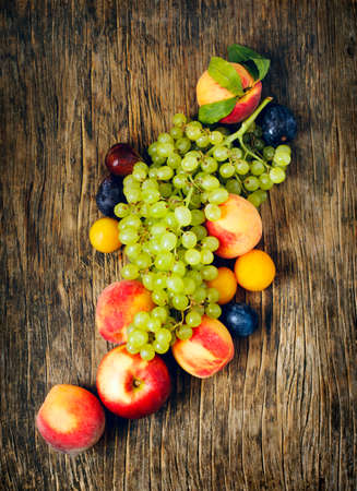 Autumn fruits on wooden background witn copy spaceの写真素材