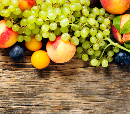 Autumn fruits on wooden background witn copy spaceの写真素材