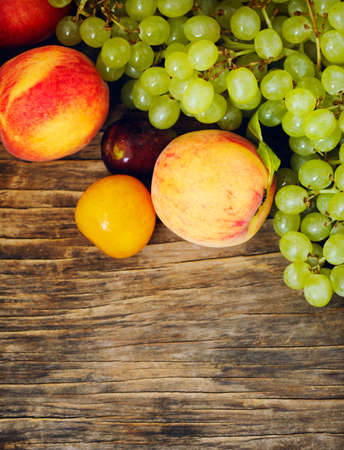 Autumn fruits on wooden background witn copy spaceの写真素材