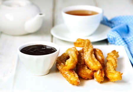 Traditional mexican dessert churros with chocolate sauceの写真素材