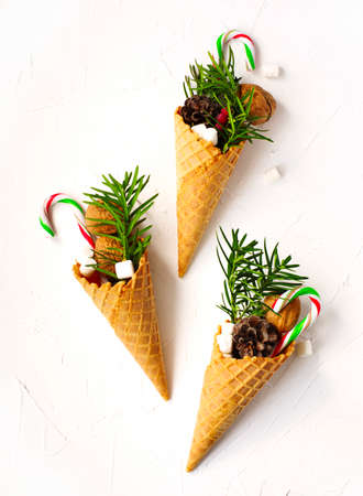 Waffle cone full of holiday gift. Christmas cardの写真素材