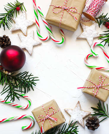 Christmas gift boxes and festive decor on white background, preparation for the holiday.の写真素材