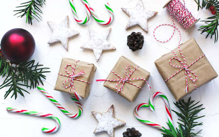 Christmas gift boxes and festive decor on white background, preparation for the holiday.の写真素材