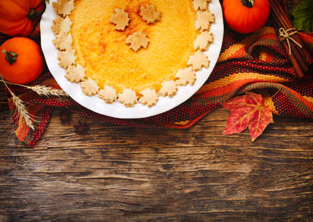 Pumpkin pie on wooden table, top viewの写真素材