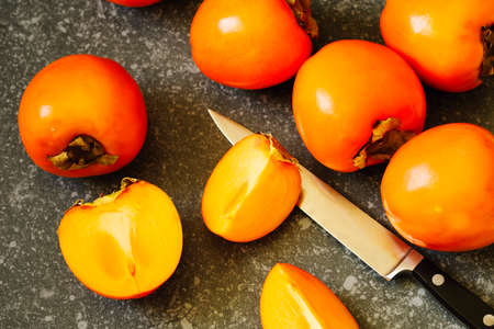 Delicious fresh persimmon fruits, top viewの写真素材