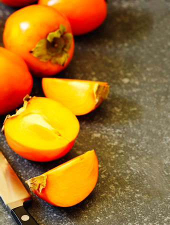 Delicious fresh persimmon fruits, copy spaceの写真素材
