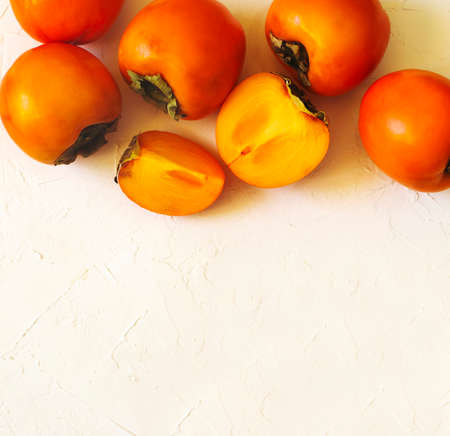 Delicious fresh persimmon fruits, top view, copy spaceの写真素材
