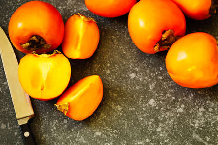 Delicious fresh persimmon fruits, top view, copy spaceの写真素材