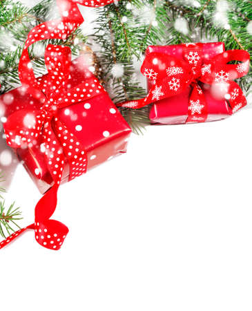 Christmas background concept. Top view of Christmas gift box with spruce branches, pine cones on white background. Christmas background with decorations and gift boxes isolated on white backgroundの写真素材