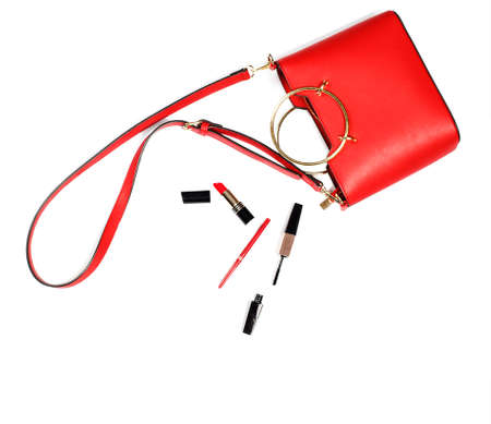 Women's red handbag and cosmetics. Top view. Fashion concept, copy spaceの写真素材