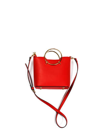 Fashion red leather handbag isolated on a white backgroundの写真素材