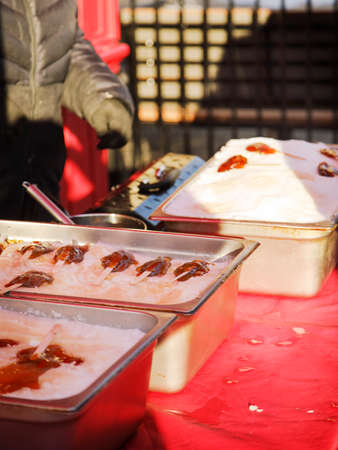 Making a maple syrup candy. Traditional canadian winter dessertの写真素材