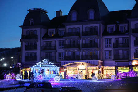 COLLINGWOOD, ON, CANADA - DECEMBER 17, 2018: Christmas decorated Blue Mountain Village in winter night, Ontario, Canadaのeditorial素材