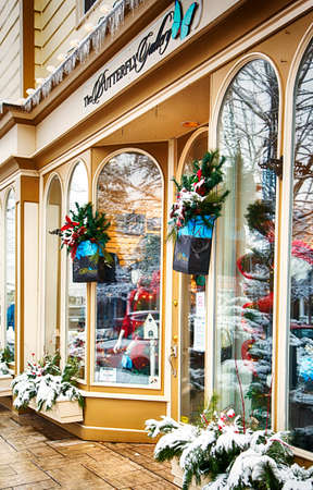 NIAGARA ON THE LAKE,CANADA - DECEMBER 2, 2019: Fashion store showcase with Christmas decoration located in the Queen Street, Niagara on the Lake, Ontario, Canadaのeditorial素材