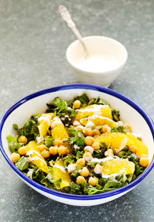 Kale, orange and chickpeas saladの写真素材
