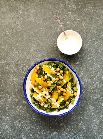 Kale, orange and chickpeas salad, top viewの写真素材