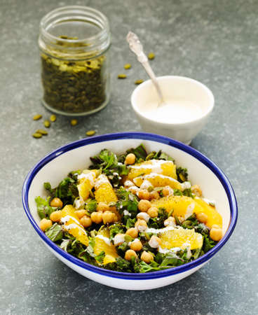 Kale, orange and chickpeas salad, top viewの写真素材