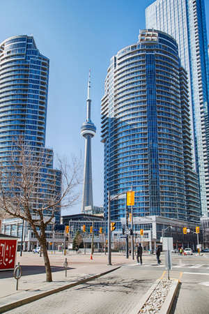 Toronto, Ontario, Canada - April 2, 2020: Downtown Toronto during Coronavirus pandemic. Rare passers-by on the street of Toronto during rush our.のeditorial素材
