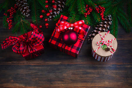 Christmas background. Fir branches and Christmas gift boxes on wooden blue background, copy space.の写真素材