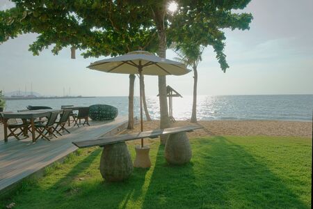 beautiful bench, armchairs and a table outdoorsの写真素材