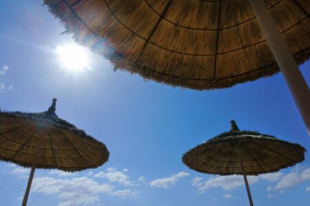 beautiful sun umbrellas on the beachの写真素材