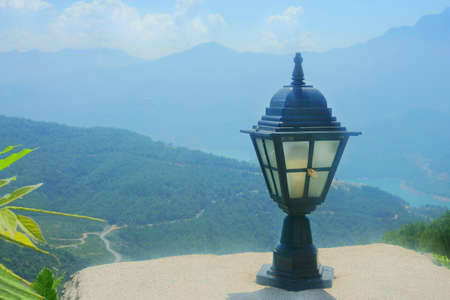 Beautiful lamp on the street on a green backgroundの写真素材