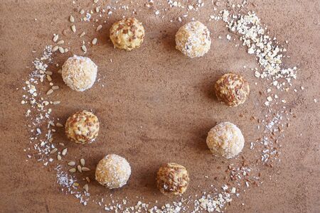 energy ball of oatmeal, coconut, flaxseeds, fruit, copy space,  top view, flat lay, image horizontal...