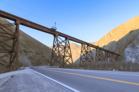 Railway bridge over the road in the mountains, California, USAの写真素材