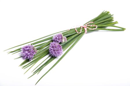 Chives with flowers isolated on white backgroundの写真素材