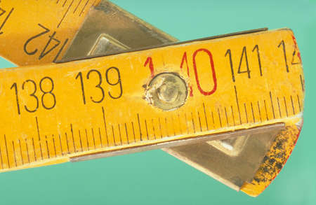 old vintage ruler  to messure on green backgroundの写真素材