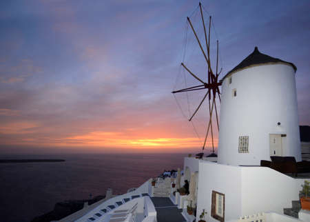 mill at traditional white village Oia Santoriniの写真素材
