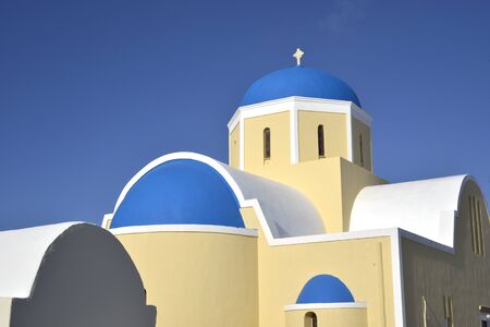 yellow blue church at Oia Santorini, Greeceの写真素材