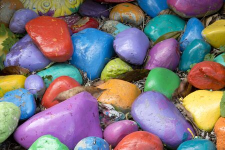 Colorful stones  yellow orange blue and green in gardenの写真素材