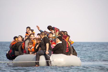LESVOS, GREECE February 02, 2016: Refugees arriving in Greece in dinghy boat from Turkey. These Syrian, Afghanistan and African refugees land their boat near Mytilene Lesvos.のeditorial素材