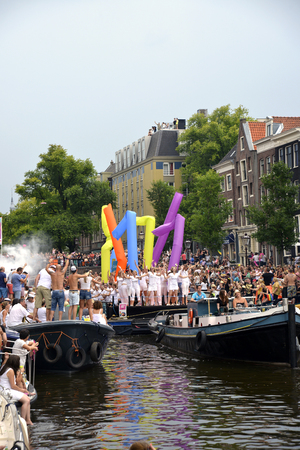 Amsterdam, Netherlands - August 2, 2014: participants in the annual event for the protection of human rights and civil equality - Gay Pride Parade on the Prinsengracht, Amsterdamのeditorial素材